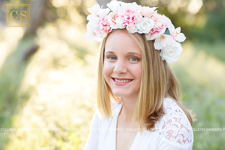 Spring senior pictures, oak trees, grass, blue dress, flower crowns, by El Dorado Hills senior photographer Colleen Sanders Photography.