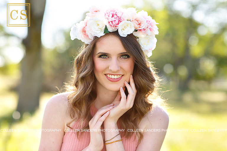 Oak Ridge senior in the class of 2017, wearing a pink shirt and jeans, floral crown in El Dorado Hills, features oak trees and grasses, by senior photographer Colleen Sanders.