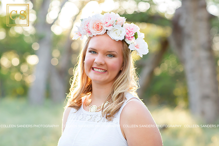 Folsom senior from Vista del Lago High School in Fosom, in fields with oak trees, floral crowns, photographed by El Dorado Hills senior photographer Colleen Sanders Photography.